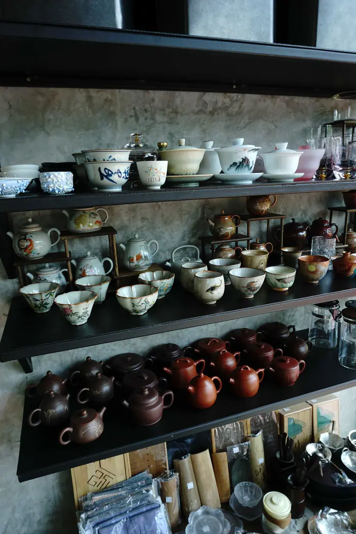 Shelves of clay teapots and porcelain cups