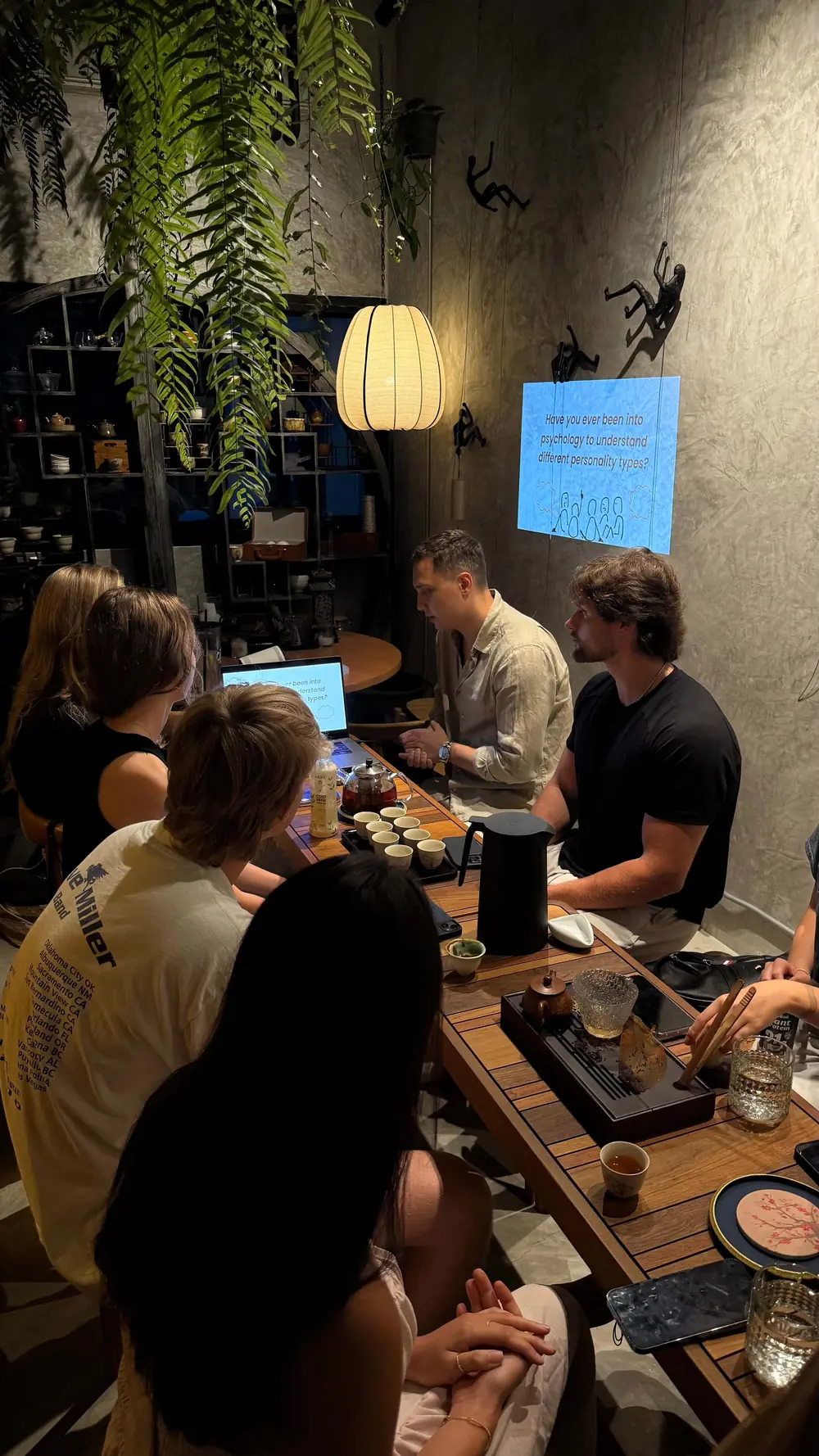 Guests at the tea table with the tea master at Moychay Phuket
